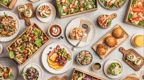 32.	Flat lay of Soul Origin Catering options, including drinks, salads, sliders, and fruit platters